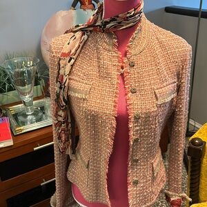 Elie Tahari tweed jacket with frayed turn back sleeves and snap closures.